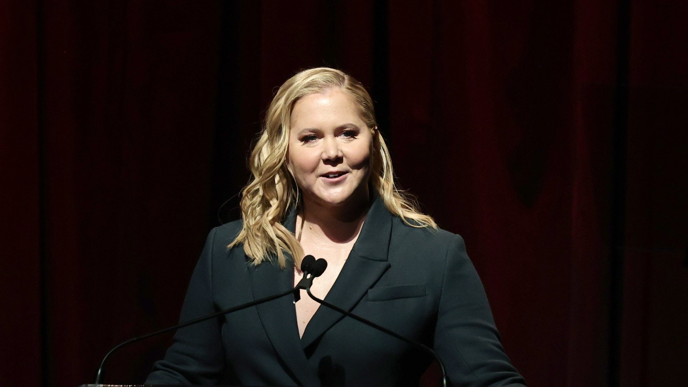 Amy Schumer Flaunts Baby Bump on ‘Kinda Pregnant’ Set